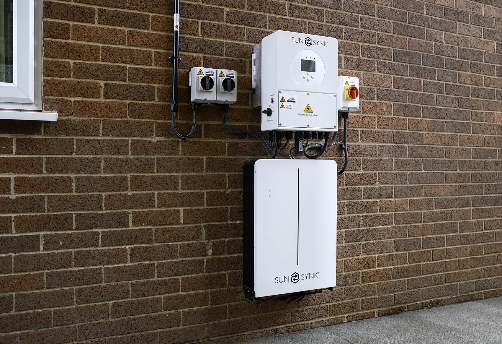 Image of a wall-mounted Sunsynk solar battery, showing how you can save energy, cut carbon & reduce grid reliance.