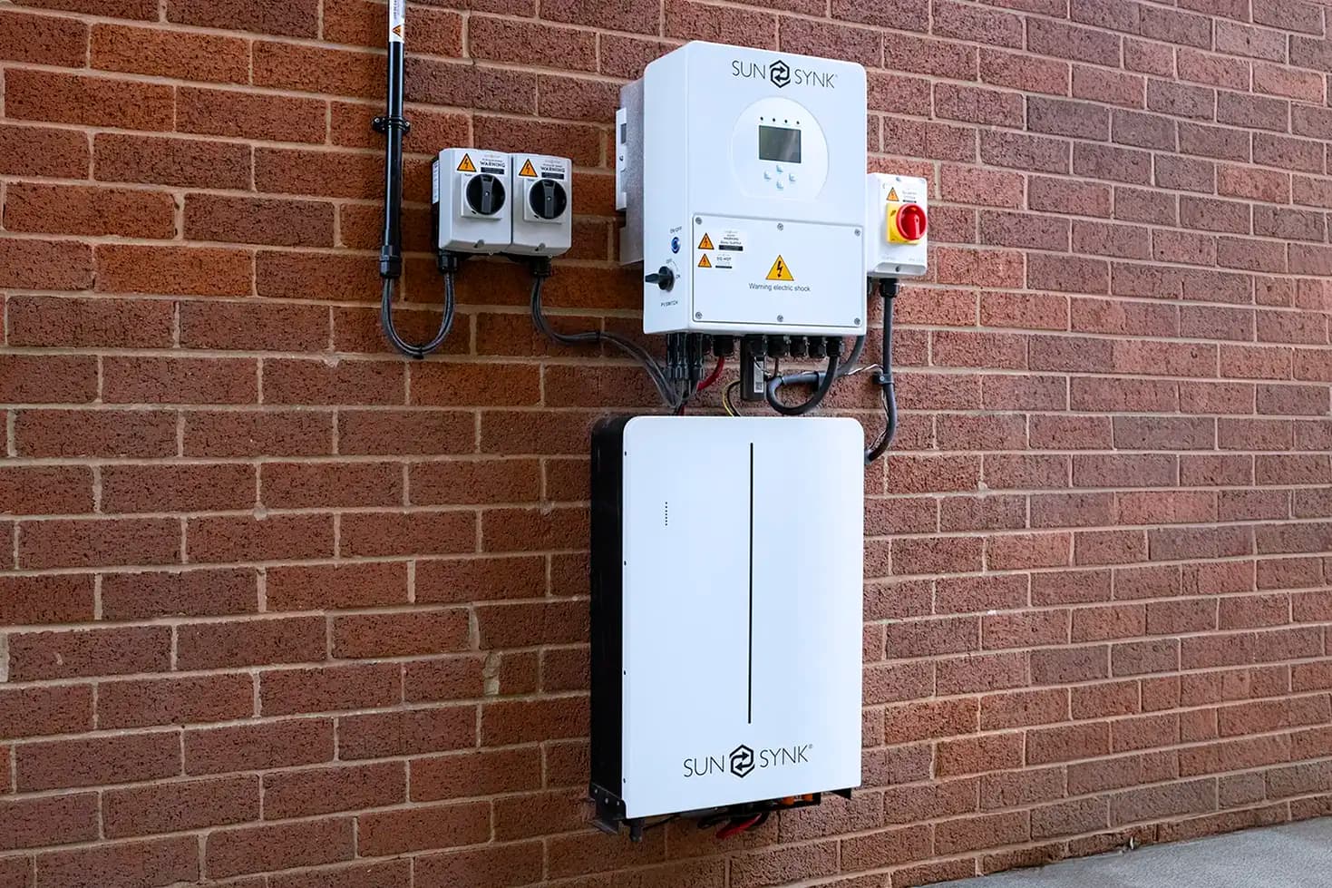 Wall‑mounted Sunsynk solar panel battery, storing excess energy generated in the day for use during lighter Spring evenings.