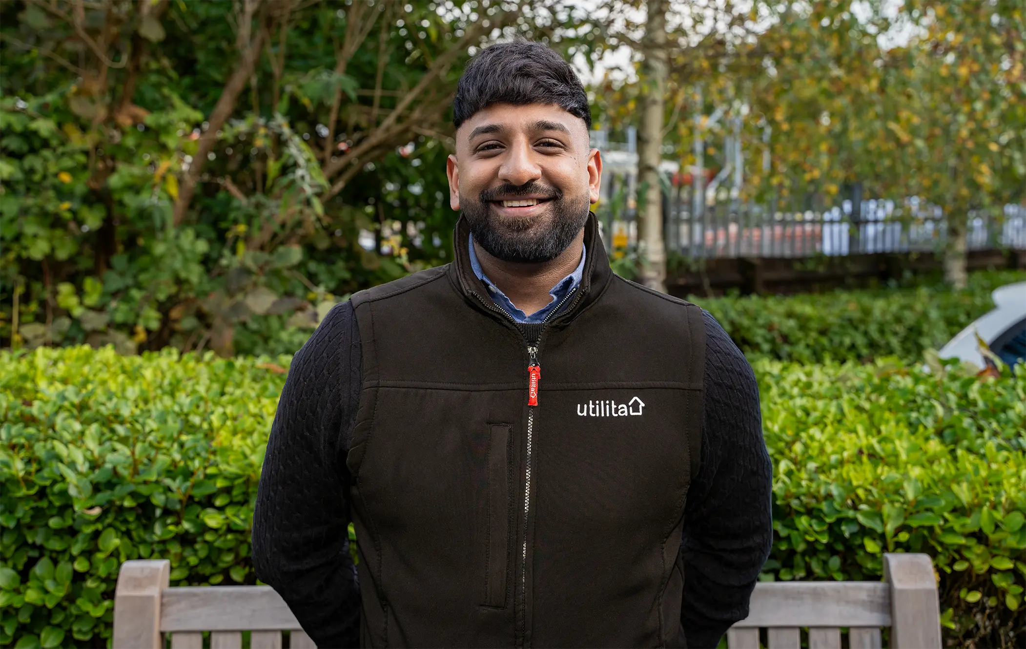 Photo of Mohammed Latif, Utilita Home Energy Consultant, stood outside with trees in the background.