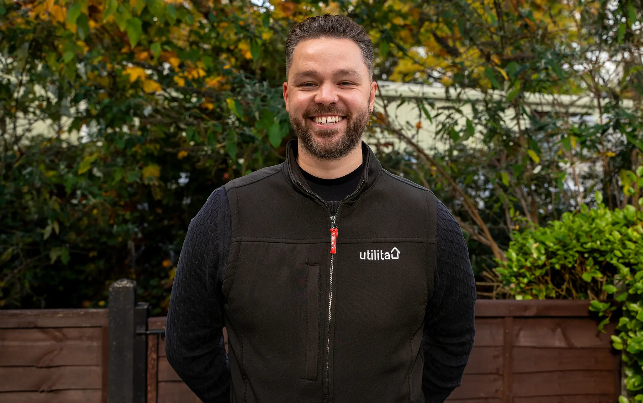 Photo of Sean Dudley-Large, Utilita Home Energy Consultant, stood outside with trees in the background.