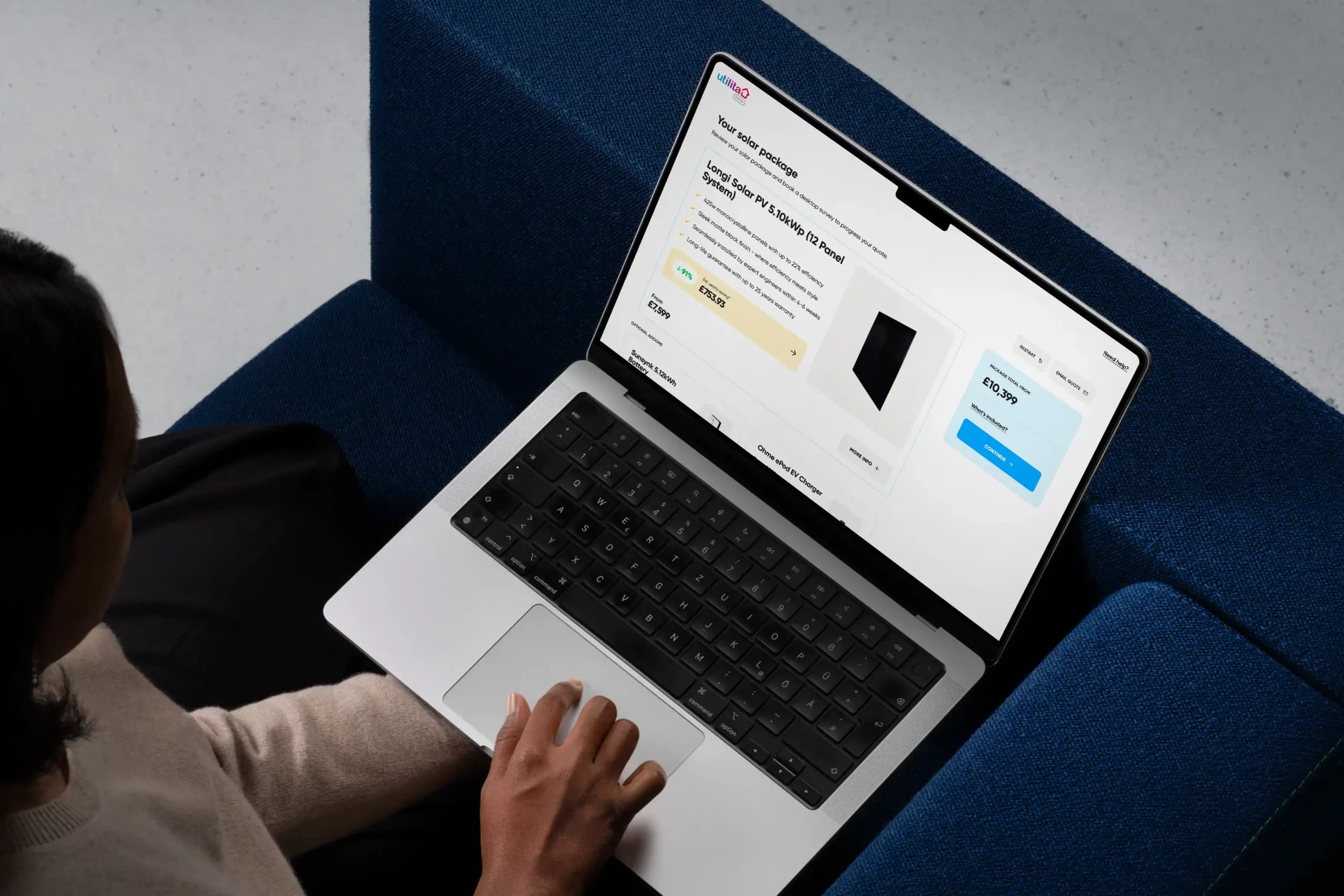 Image of a person using a laptop to get a quote with Utilita Home so they can begin to save with solar.