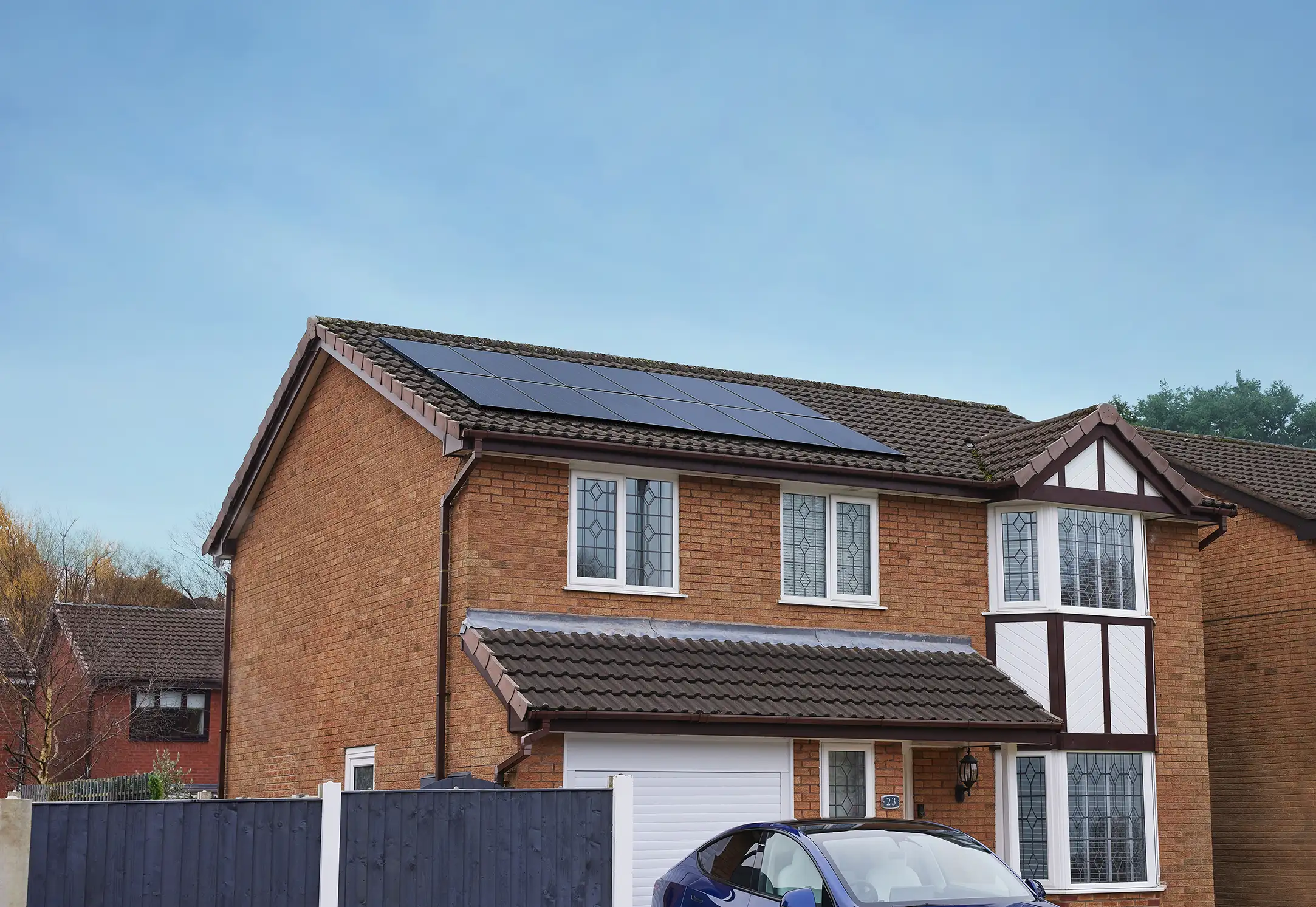 12 panel system installed on the roof of a detached house, symbolising the rising price of solar panels in the UK.